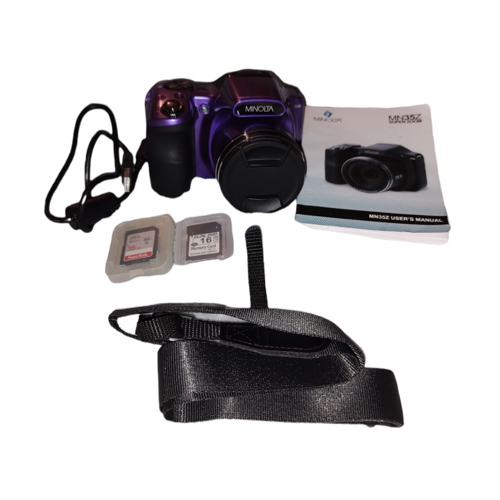 Unused in brand new condition Minolta purple camera.